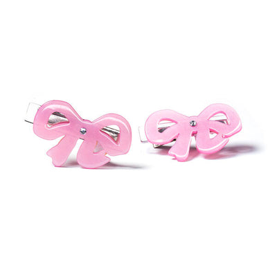 Pair of metal based hair clips adorned with one acrylic pink bow on each