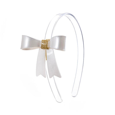 Clear headband adorned with white statement bow