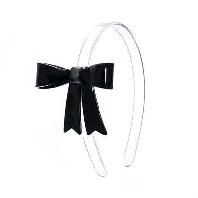 Clear headband adorned with a statement black bow