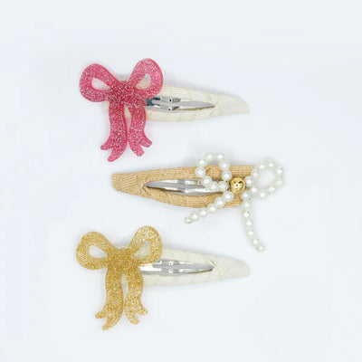 Set of three snap clips, each adorned with one acrylic made bow