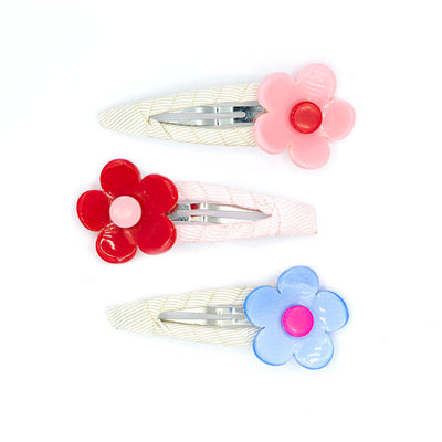 Set of three hair clips adorned with flowers. One flower has pink petals and red in the middle, one has red petals and pink in the middle and the last one has blue petals and a hot pink middle.