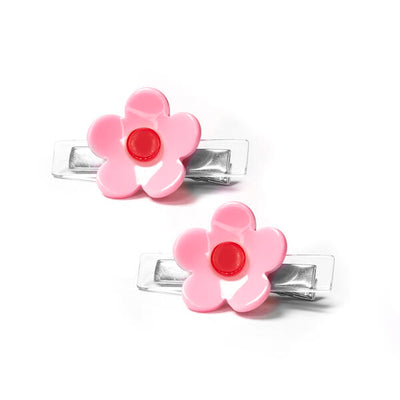 Pair of metal hair clips adorned with a clear acrylic base and a pink and red flower on each. 