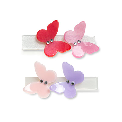 Pair of hair clips adorned with two butterflies each. 