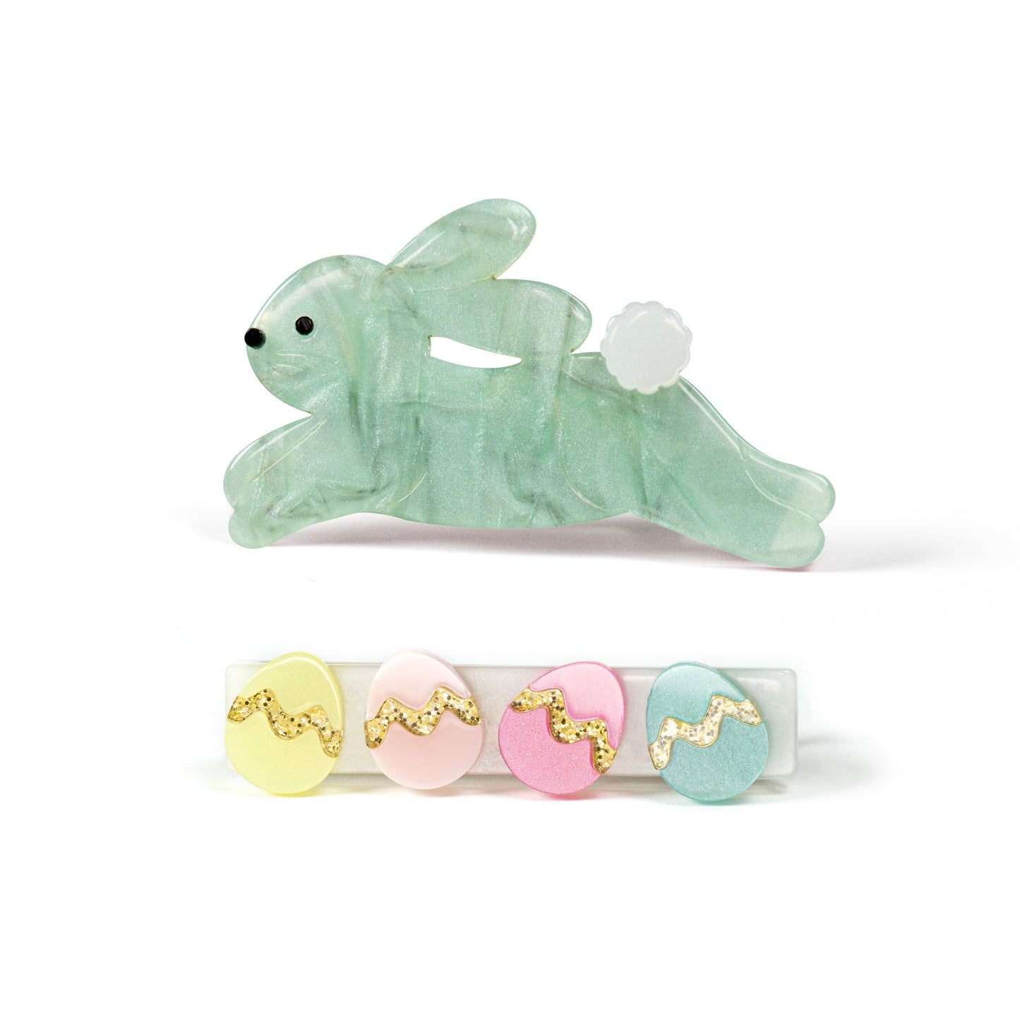 Pair of hair clips. One of them is adorned with a pearlized green bunny in hopping motion. The second one has 4 Easter eggs in pastel colors.