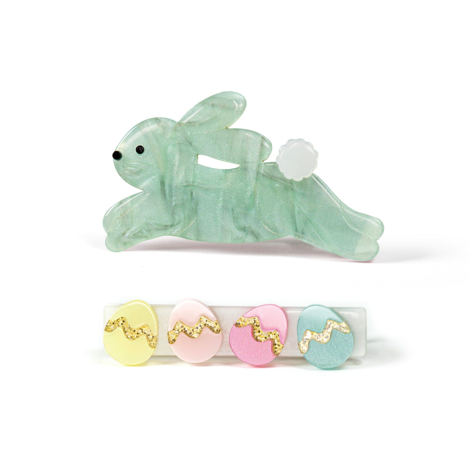 Pair of hair clips. One of them is adorned with a pearlized green bunny in hopping motion. The second one has 4 Easter eggs in pastel colors.