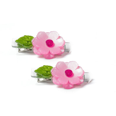 Metal based hair clips adorned with a pink flower with a green leaf
